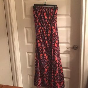 Halter top dress.  Burnt orange color and blue.  has belt loops but I lost belt.